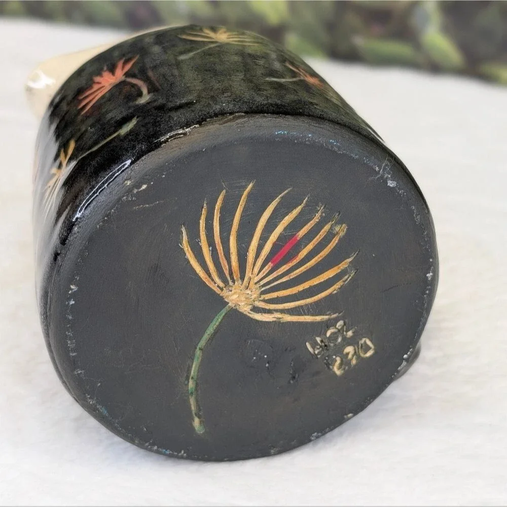 Handcrafted Black Ceramic Pitcher with Floral Design